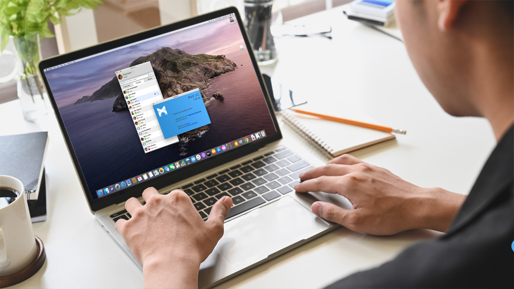 Man working from home using MaX Communicator