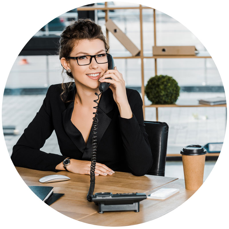 business woman talking on phone in office